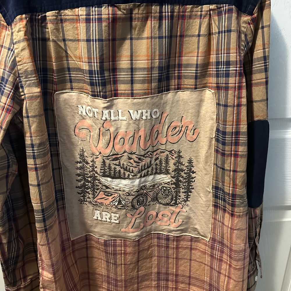 Casual button shirt with graphic tee on back.